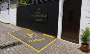 a parking sign in front of a building at Casa Santiago Son 2 in Antigua Guatemala +10 photos