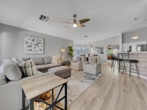 a living room with a couch and a table at 153rd Surprise in Surprise
