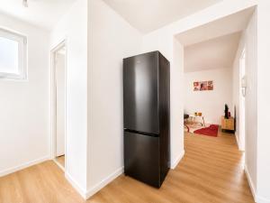 a refrigerator in the middle of a room at 8B - Le Cosy in Saint-Rambert-dʼAlbon