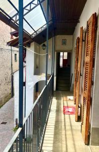 a hallway of a building with a door and stairs at Casa Giù Là in Quarna Sopra +4 photos