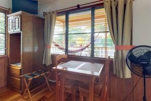 a dining room with a table and a window at Starfish Cabana at Latitude Adjustment -Gold Standard Certified in Hopkins