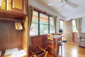 a living room with a table and a window at Starfish Cabana at Latitude Adjustment -Gold Standard Certified in Hopkins