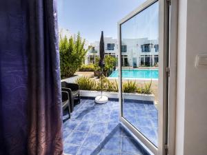 a view from the balcony of a house with a pool at Vanessa Puerto del Carmen in Tías
