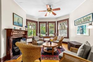 a living room with furniture and a fireplace at Inn at the Oaks in Eastham