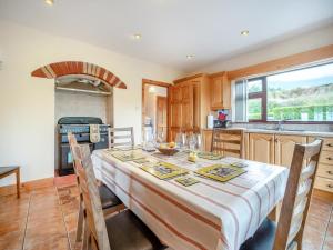 a kitchen with a table with a white table cloth on it at 4 Bed in Inch oc-ii11636 in Caheracruttera