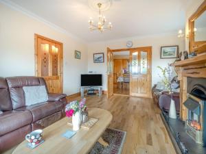 a living room with a couch and a table at 4 Bed in Inch oc-ii11636 in Caheracruttera