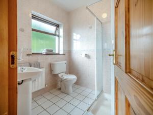a bathroom with a toilet and a sink and a shower at 4 Bed in Inch oc-ii11636 in Caheracruttera +25 photos