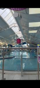 a large swimming pool in a large building at Relax&Dreams caravan in Port Seton