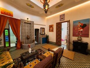 a living room with a couch and a table at Golden house in El Jadida