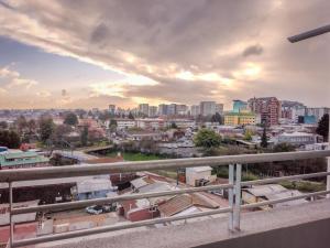 a view of a city from a balcony at Apart Total Aldunate Temuco Centro 2 in Temuco