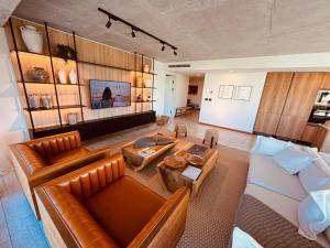 an overhead view of a living room with a leather couch at Surfside - 3 Suítes - 4 Bathroom in Punta del Este