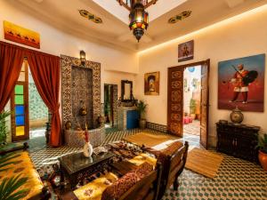 a living room with a couch and a table at Golden house in El Jadida