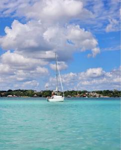 a sailboat in the water on a body of water at Yacht for rent in Bacalar in Bacalar +11 photos