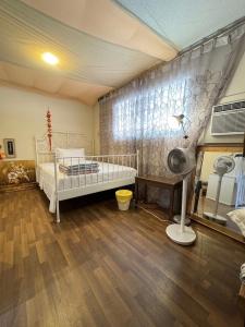 a bedroom with a bed and a fireplace in it at Richmond cozy room in Richmond
