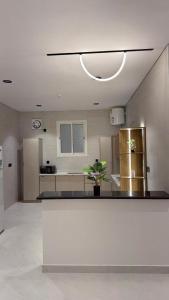 a large room with a kitchen with a counter top at Rose House 2 in Taif