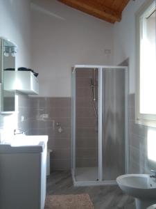 a bathroom with a shower and a sink at Up b&b in Offanengo
