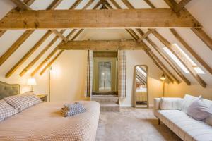 a living room with a bed and a couch at 6 Bed in Ardleigh oc-b35089 in Ardleigh