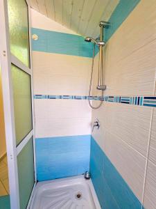 a bathroom with a shower with a toilet in it at Sunrise Dhermi Beach in Dhërmi