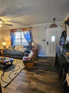 a living room with a couch and a table at Rowan's Mountain View in Powell