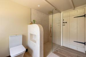 a bathroom with a glass shower and a toilet at 3 Bed in Ditchingham oc-s42751 in Ditchingham +52 photos