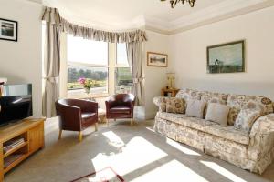 a living room with a couch and a tv at 3 Bed in Bassenthwaite oc-lr197 in Bassenthwaite