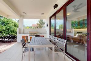 a dining room with a table and chairs at Green Tower House in Placencia