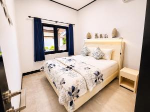 a bedroom with a bed and a window at Bugbug Beach Resort in Gili Biaha +151 photos