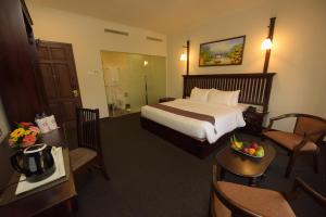 Rúm í herbergi á Hotel Nippon Colombo