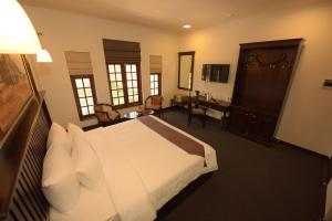 Rúm í herbergi á Hotel Nippon Colombo