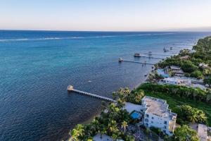 an aerial view of a beach with houses and the ocean at Relaxing condo with shared pool ocean views partial AC & WiFi in San Pedro