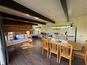 a kitchen and dining room with a table and chairs at Cambridge Top 10 Holiday Park in Cambridge