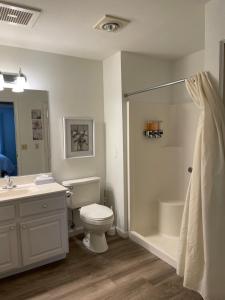 a bathroom with a toilet and a sink and a shower at Highland Estates Condotel in Mesquite +50 photos