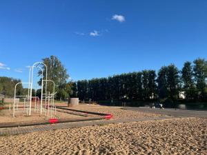 a park with a playground with a goal at Riverside Apartment Tartu in Tartu