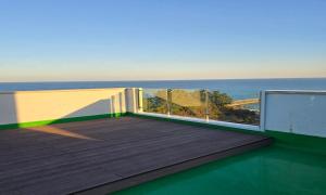 a balcony with a view of the ocean at Mobydick Hotel in Yangyang