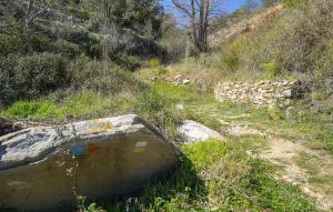 a cement tub sitting on the side of a hill at Los Moreno in Laroya +9 photos