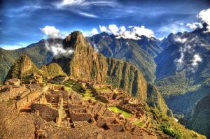 a view of the ruins of machu picchu in the mountains at Colpapampa Lodge in Colcapampa