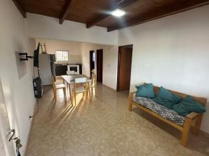 a living room with a couch and a table at aura in La Falda