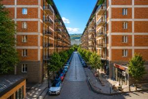 an empty street between two tall buildings at Home Inn Apartments Your house Jikia-Central Tbilisi in Tbilisi City +19 photos