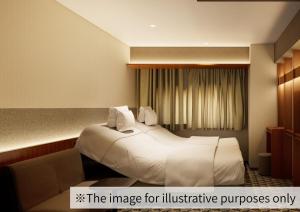 a hotel room with a large bed and a couch at Hotel Gracery Ginza in Tokyo +80 photos