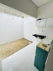 a bathroom with a toilet in the corner of a room at Casa da Gi em Piranhas in Piranhas +12 photos