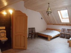 A bed or beds in a room at Lesnoy Holiday Home