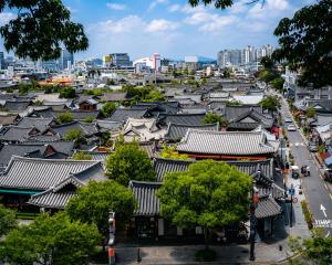 an overhead view of a city with buildings and roofs at HOTEL THE MAY Jongno in Seoul