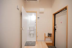 a bathroom with a toilet in a room at NEW OPEN! HOTEL Kozafornia in Okinawa City +152 photos