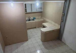 a bathroom with a sink and a toilet in a room at Capsule room with aircon in Manila