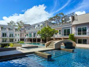 an exterior view of a mansion with a swimming pool at J7 Angkor Hotel in Siem Reap