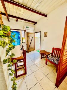 a living room with two chairs and a table and a table at PROMOCIOn VILLA PRIVADA SPRING in Puerto Ayora +17 photos