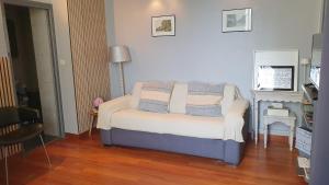 a living room with a bed and a fireplace at RESIDENCE HERMITAGE LE TOUQUET in Le Touquet-Paris-Plage