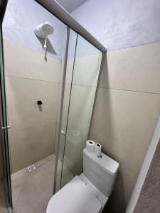 a small bathroom with a toilet and a shower at Pousada Bonetti Quarto 9 in Santa Rosa