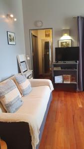 a hotel room with two beds and a piano at RESIDENCE HERMITAGE LE TOUQUET in Le Touquet-Paris-Plage