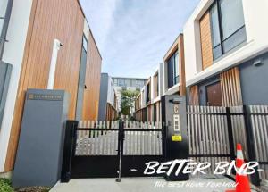 a black gate in front of a building at The Elegant Corner in Wellington +3 photos
